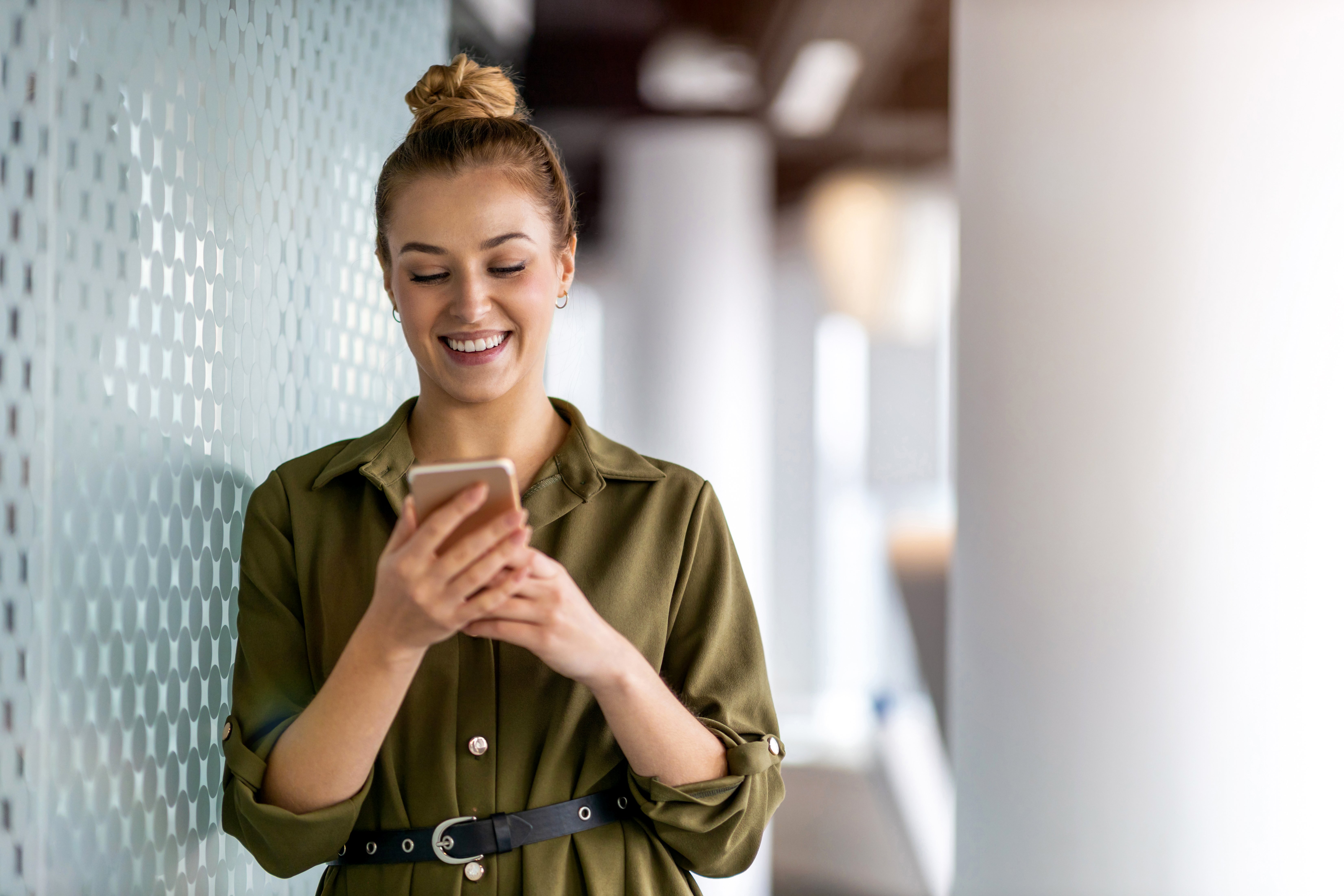 female-european-adult-indoor-as-businesswoman-using-a-smartphone-web